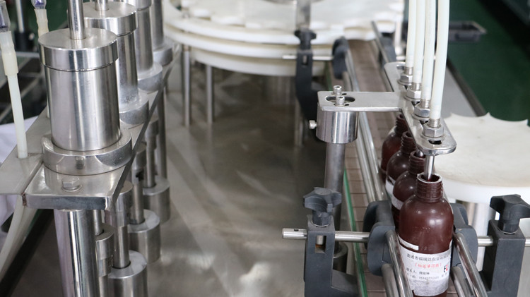 500ml round bottle filling machine with cap sealing and star wheel running